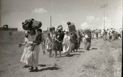 June 13, 1948: The expulsion of Tantura women, children and elderly from Fureidis to Jordan. The Red Cross is supervising. (Beno Rothenberg collection, courtesy of the Israel State Archives. All rights reserved.)