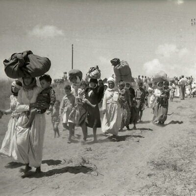 June 13, 1948: The expulsion of Tantura women, children and elderly from Fureidis to Jordan. The Red Cross is supervising. (Beno Rothenberg collection, courtesy of the Israel State Archives. All rights reserved.)