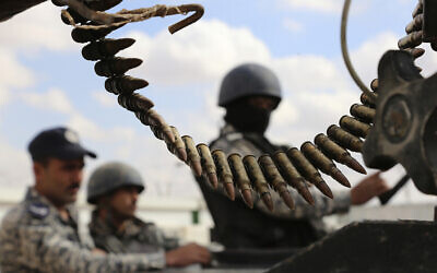 Illustrative: Jordanian soldiers stand at the northeastern border with Syria, Feb. 14, 2017. (Raad Adayleh/AP)