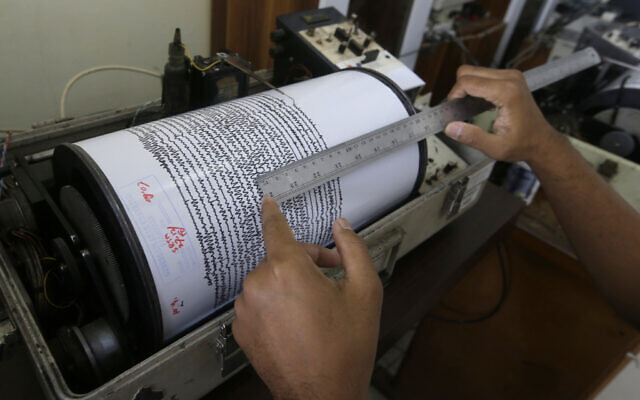 Illustrative -- An official looks a seismograph at an observation post near a recent volcanic eruption in Carita, Indonesia, Dec. 27, 2018 (AP Photo/Achmad Ibrahim) Illustrative -- An official looks a seismograph at an observation post near a recent volcanic eruption in Carita, Indonesia, Dec. 27, 2018 (AP Photo/Achmad Ibrahim)