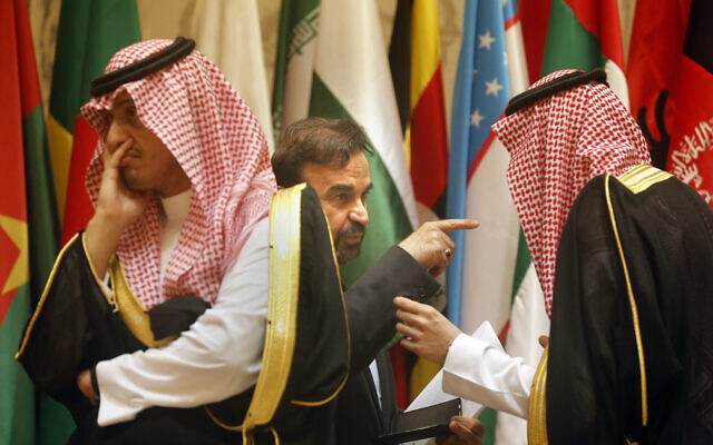 Illustrative: Then-director general of International Peace and Security Department at Iran's Foreign Ministry, Reza Najafi, center, talks to a Saudi protocol official during a group picture of leaders attending Islamic Summit of the Organization of Islamic Cooperation (OIC) in Mecca, Saudi Arabia, June 1, 2019. (AP Photo/Amr Nabil)