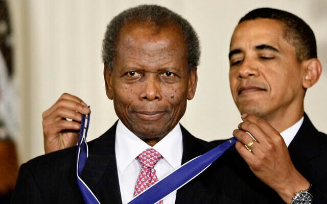 Then US President Barack Obama presents the 2009 Presidential Medal of Freedom to Sidney Poitier during ceremonies in the East Room at the White House in Washington on, Aug. 12, 2009. (AP Photo/J. Scott Applewhite, File) Then US President Barack Obama presents the 2009 Presidential Medal of Freedom to Sidney Poitier during ceremonies in the East Room at the White House in Washington on, Aug. 12, 2009. (AP Photo/J. Scott Applewhite, File)