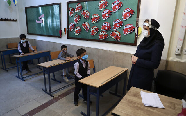 Illustrative: Students and their teacher at the Hashtroudi school in Tehran, Iran, on Saturday, September 5, 2020. (AP Photo/Vahid Salemi) Illustrative: Students and their teacher at the Hashtroudi school in Tehran, Iran, on Saturday, September 5, 2020. (AP Photo/Vahid Salemi)