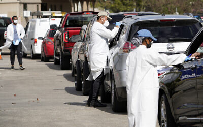 Illustrative -- Healthcare workers process people waiting in line at a United Memorial Medical Center COVID-19 testing site, Nov. 19, 2020, in Houston  (AP Photo/David J. Phillip)