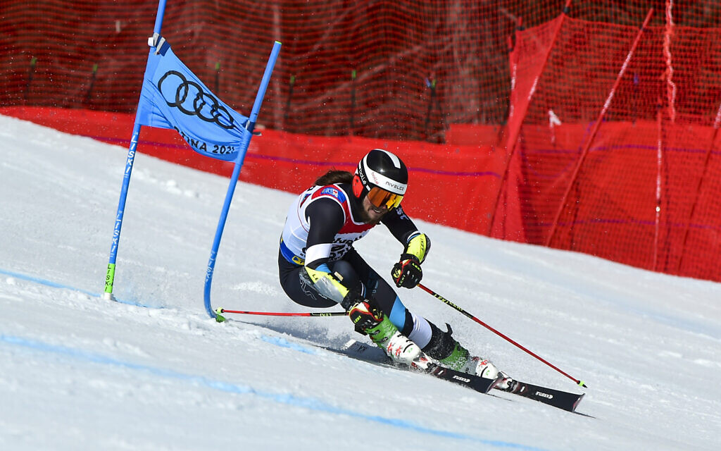 Barnabas Szollos speeds down the course during a men's giant slalom, at the alpine ski World Championships, in Cortina d'Ampezzo, Italy, Feb. 19, 2021. (AP Photo/Marco Tacca)