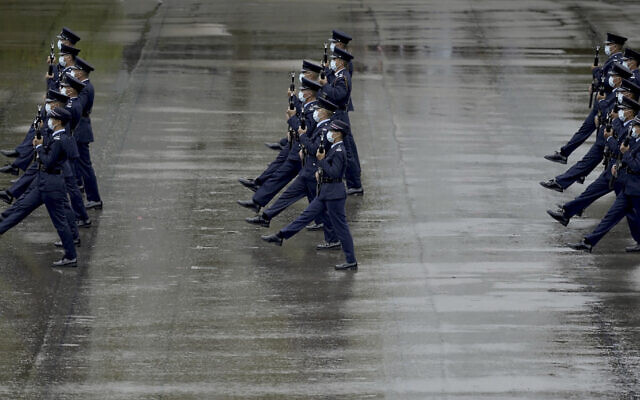 Hong Kong police show their new goose step marching style on the National Security Education Day at a police school in Hong Kong Thursday, April 15, 2021. (AP Photo/Vincent Yu) Hong Kong police show their new goose step marching style on the National Security Education Day at a police school in Hong Kong Thursday, April 15, 2021. (AP Photo/Vincent Yu)