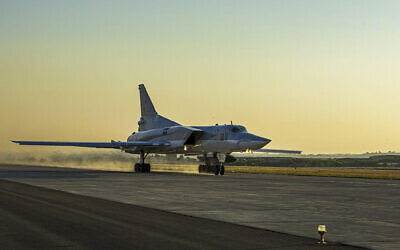 In this photo released by Russian Defense Ministry Press Service on Friday, June 25, 2021, a Tu-22M3 bomber of the Russian air force takes off from the Hemeimeem air base in Syria. (Russian Defense Ministry Press Service via AP)