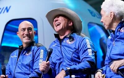 Mark Bezos, left, Jeff Bezos, center, founder of Amazon and space tourism company Blue Origin, and Wally Funk, right, make comments during a post launch news briefing from its spaceport near Van Horn, Texas, Tuesday, July 20, 2021. (AP Photo/Tony Gutierrez)