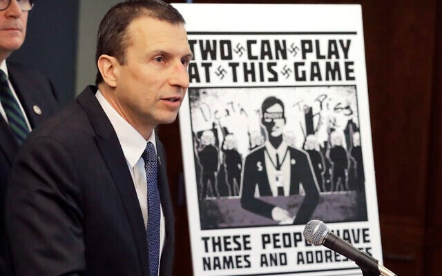 FILE - In this Feb. 26, 2020, file photo, Raymond Duda, special agent in charge in Seattle, speaks as he stands next to a poster that was mailed earlier in the year to the home of Chris Ingalls, an investigative reporter with KING-TV in Seattle, during a news conference in Seattle. A federal jury in Seattle on Wednesday, Sept. 29, 2021, convicted Kaleb Cole, a leader of a neo-Nazi campaign to threaten journalists and Jewish activists in three states. Cole and three others were charged last year with having sent Swastika-laden posters to journalists and people affiliated with the Anti-Defamation League in Washington, Florida and Arizona. (AP Photo/Ted S. Warren, File) FILE - In this Feb. 26, 2020, file photo, Raymond Duda, special agent in charge in Seattle, speaks as he stands next to a poster that was mailed earlier in the year to the home of Chris Ingalls, an investigative reporter with KING-TV in Seattle, during a news conference in Seattle. A federal jury in Seattle on Wednesday, Sept. 29, 2021, convicted Kaleb Cole, a leader of a neo-Nazi campaign to threaten journalists and Jewish activists in three states. Cole and three others were charged last year with having sent Swastika-laden posters to journalists and people affiliated with the Anti-Defamation League in Washington, Florida and Arizona. (AP Photo/Ted S. Warren, File)