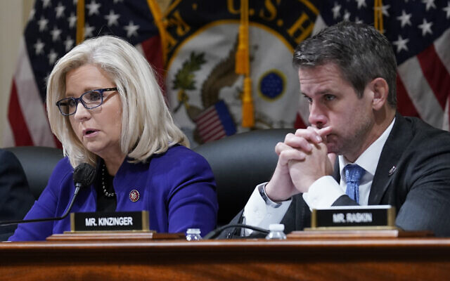 Republican Representative Liz Cheney of Wyoming, and Republican Representative Adam Kinzinger of Illinois, listen as the House select committee tasked with investigating the January 6 attack on the US Capitol meets on Capitol Hill in Washington, DC, on October 19, 2021. (AP Photo/J. Scott Applewhite)