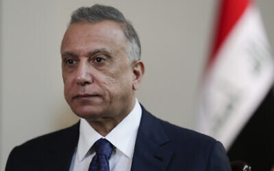 Iraqi Prime Minister Mustafa al-Kadhimi poses in his office during an interview with The Associated Press in Baghdad, Iraq, on July 23, 2021. (Khalid Mohammed/AP)