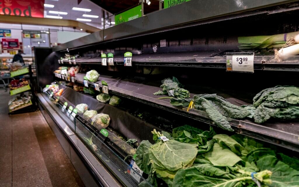 Nearly empty shelves of produce at a supermarket in Washington, Tuesday, Jan. 4, 2022. (AP Photo/Andrew Harnik) Nearly empty shelves of produce at a supermarket in Washington, Tuesday, Jan. 4, 2022. (AP Photo/Andrew Harnik)