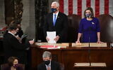 Vice President Mike Pence presides over a joint session of Congress as it convenes to count the Electoral College votes cast in November's election, at the Capitol in Washington, Jan. 6, 2021. Speaker of the House Nancy Pelosi, D-Calif., stands at right.(Saul Loeb/Pool via AP, File)