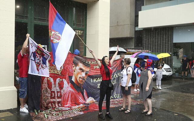 Protestors gather outside an immigration detention hotel where Serbia's Novak Djokovic is believed to stay, in Melbourne, Australia, Jan. 7, 2022 (AP Photo/Hamish Blair) Protestors gather outside an immigration detention hotel where Serbia's Novak Djokovic is believed to stay, in Melbourne, Australia, Jan. 7, 2022 (AP Photo/Hamish Blair)