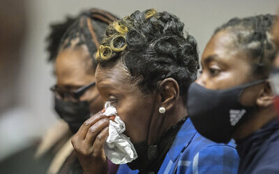 Ahmaud Arbery's mother Wanda Cooper-Jones, center, reacts as Superior Court Judge Timothy Walmsley sentences Greg McMichael, his son, Travis McMichael, and a neighbor, William "Roddie" Bryan in the Glynn County Courthouse, January 7, 2022, in Brunswick, Georgia. (AP Photo/Stephen B. Morton, Pool) Ahmaud Arbery's mother Wanda Cooper-Jones, center, reacts as Superior Court Judge Timothy Walmsley sentences Greg McMichael, his son, Travis McMichael, and a neighbor, William "Roddie" Bryan in the Glynn County Courthouse, January 7, 2022, in Brunswick, Georgia. (AP Photo/Stephen B. Morton, Pool)