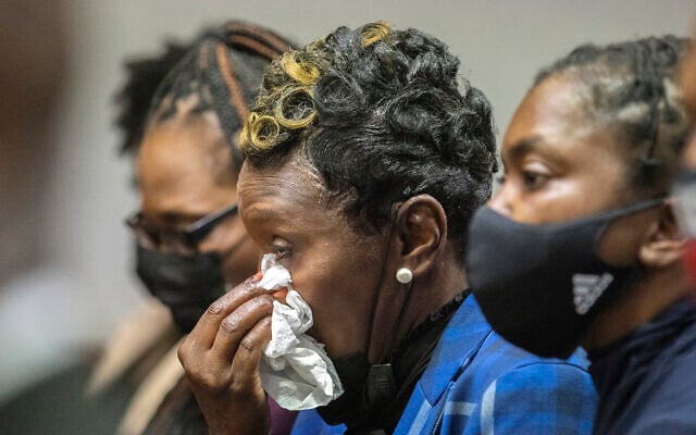 Ahmaud Arbery's mother Wanda Cooper-Jones, center, reacts as Superior Court Judge Timothy Walmsley sentences Greg McMichael, his son, Travis McMichael, and a neighbor, William "Roddie" Bryan in the Glynn County Courthouse, January 7, 2022, in Brunswick, Georgia. (AP Photo/Stephen B. Morton, Pool) Ahmaud Arbery's mother Wanda Cooper-Jones, center, reacts as Superior Court Judge Timothy Walmsley sentences Greg McMichael, his son, Travis McMichael, and a neighbor, William "Roddie" Bryan in the Glynn County Courthouse, January 7, 2022, in Brunswick, Georgia. (AP Photo/Stephen B. Morton, Pool)