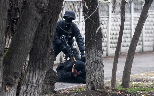 An armed riot police officer detains a protester during a security anti-terrorists operation in a street after clashes in Almaty, Kazakhstan, Jan. 8, 2022 (AP Photo/Vasily Krestyaninov) An armed riot police officer detains a protester during a security anti-terrorists operation in a street after clashes in Almaty, Kazakhstan, Jan. 8, 2022 (AP Photo/Vasily Krestyaninov)