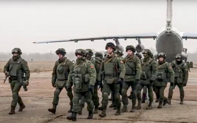 In this handout photo released by Russian Defense Ministry Press Service, Belarusian peacekeepers leave a Russian military plane at an airfield in Kazakhstan, January 8, 2022. (Russian Defense Ministry Press Service via AP) In this handout photo released by Russian Defense Ministry Press Service, Belarusian peacekeepers leave a Russian military plane at an airfield in Kazakhstan, January 8, 2022. (Russian Defense Ministry Press Service via AP)
