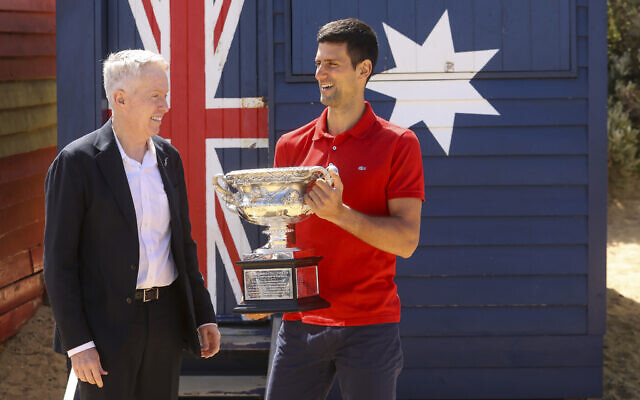 Serbia's Novak Djokovic, right, stands with Australian Open tournament director Craig Tiley for a trophy photo shoot following his win the Australian Open tennis championships in Melbourne, Australia, February 22, 2021. (AP Photo/Hamish Blair) Serbia's Novak Djokovic, right, stands with Australian Open tournament director Craig Tiley for a trophy photo shoot following his win the Australian Open tennis championships in Melbourne, Australia, February 22, 2021. (AP Photo/Hamish Blair)