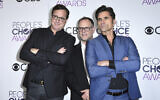 Bob Saget, from left, Dave Coulier and John Stamos, winners of the award for favorite premium comedy series for "Fuller House," pose in the press room at the People's Choice Awards at the Microsoft Theater on Jan. 18, 2017, in Los Angeles. (Photo by Jordan Strauss/Invision/AP, File)
