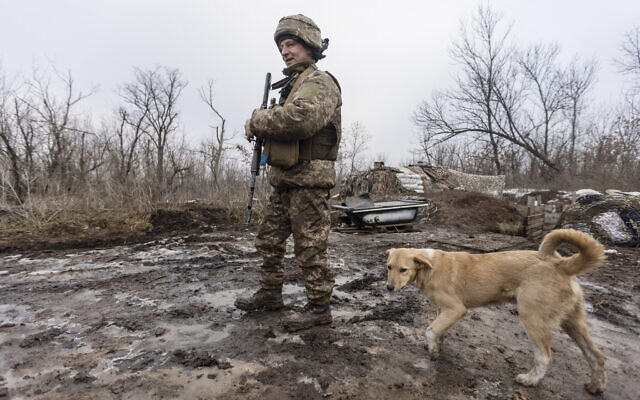 A Ukrainian soldier walks on the line of separation from pro-Russian rebels, Donetsk region, Ukraine, January 10, 2022 (AP Photo/Andriy Dubchak) A Ukrainian soldier walks on the line of separation from pro-Russian rebels, Donetsk region, Ukraine, January 10, 2022 (AP Photo/Andriy Dubchak)
