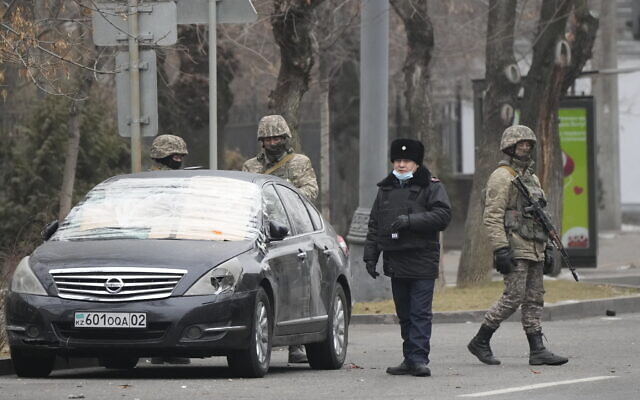 Kazakhstan troops and police block a street in Almaty, Kazakhstan, Jan. 10, 2022. (AP Photo) Kazakhstan troops and police block a street in Almaty, Kazakhstan, Jan. 10, 2022. (AP Photo)