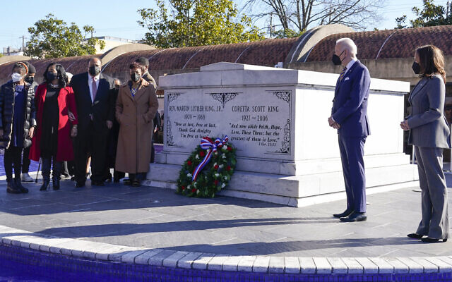 US President Joe Biden (second right) and Vice President Kamala Harris (far right) pause with Martin Luther King III and other members of the King family after a wreath laying at the tomb of the Rev. Martin Luther King Jr., and his wife Coretta Scott King, on Tuesday, January 11, 2022, in Atlanta. (AP/Patrick Semansky) US President Joe Biden (second right) and Vice President Kamala Harris (far right) pause with Martin Luther King III and other members of the King family after a wreath laying at the tomb of the Rev. Martin Luther King Jr., and his wife Coretta Scott King, on Tuesday, January 11, 2022, in Atlanta. (AP/Patrick Semansky)