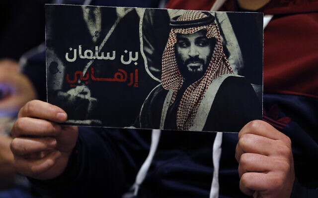 A supporter of the Iranian-backed Hezbollah terror group holds a poster of Saudi Prince Mohammed bin Salman with Arabic words that read: 'Bin Salman is a terrorist,' during a conference for Saudi opposition in the southern Beirut suburb of Dahiyeh, Lebanon, on January 12, 2022. (AP Photo/Bilal Hussein) A supporter of the Iranian-backed Hezbollah terror group holds a poster of Saudi Prince Mohammed bin Salman with Arabic words that read: 'Bin Salman is a terrorist,' during a conference for Saudi opposition in the southern Beirut suburb of Dahiyeh, Lebanon, on January 12, 2022. (AP Photo/Bilal Hussein)
