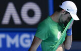 Defending men's champion Serbia's Novak Djokovic practices on Margaret Court Arena ahead of the Australian Open tennis championship in Melbourne, Australia on Jan. 13, 2022. (AP Photo/Mark Baker)
