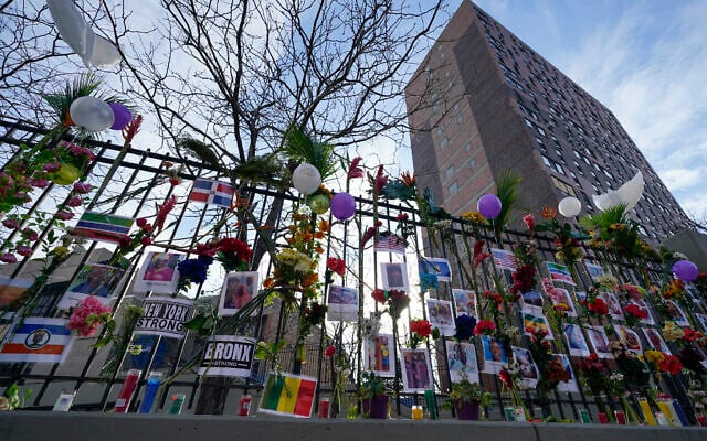 A memorial for the victims of an apartment building fire is displayed in front of the building in the Bronx borough of New York, January 13, 2022. (AP Photo/Seth Wenig) A memorial for the victims of an apartment building fire is displayed in front of the building in the Bronx borough of New York, January 13, 2022. (AP Photo/Seth Wenig)