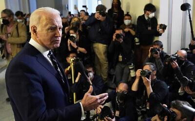 US President Joe Biden speaks to the media after meeting privately with Senate Democrats, Jan. 13, 2022, on Capitol Hill in Washington. (AP Photo/Andrew Harnik) US President Joe Biden speaks to the media after meeting privately with Senate Democrats, Jan. 13, 2022, on Capitol Hill in Washington. (AP Photo/Andrew Harnik)