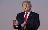 Former US president Donald Trump prepares to take the stage during a rally in Perry, Georgia, on September 25, 2021. (AP Photo/Ben Gray, File)
