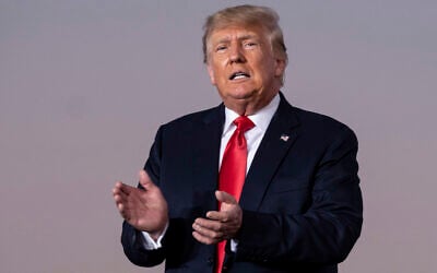Former US president Donald Trump prepares to take the stage during a rally in Perry, Georgia, on September 25, 2021. (AP Photo/Ben Gray, File)