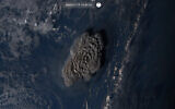 Satellite image taken by Himawari-8, a Japanese weather satellite operated by Japan Meteorological Agency and released by National Institute of Information and Communications Technology (NICT), shows an undersea volcano eruption at the Pacific nation of Tonga Saturday, Jan. 15, 2022. (NICT via AP)