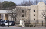 Police stand in front of the Congregation Beth Israel synagogue, January 16, 2022, in Colleyville, Texas. (AP Photo/Brandon Wade)
