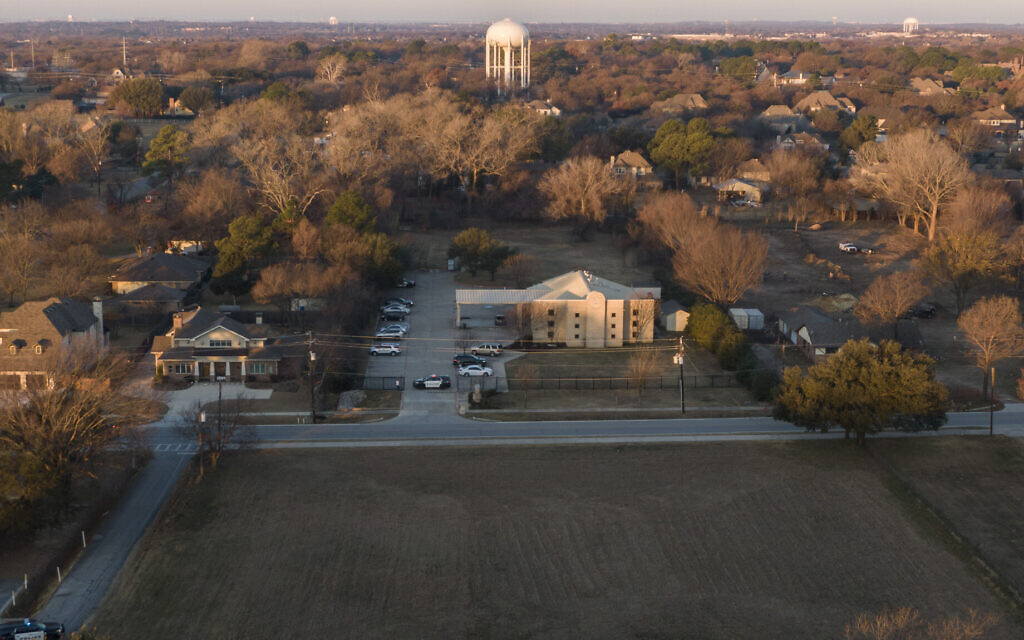 An aerial view of police standing in front of the Congregation Beth Israel synagogue, Sunday, Jan. 16, 2022, in Colleyville, Texas. (AP/Brandon Wade) An aerial view of police standing in front of the Congregation Beth Israel synagogue, Sunday, Jan. 16, 2022, in Colleyville, Texas. (AP/Brandon Wade)