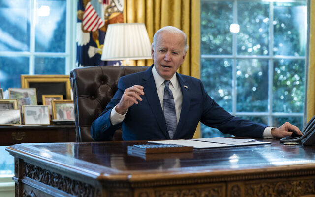 US President Joe Biden speaks before signing an executive order to improve government services, in the Oval Office of the White House, Dec. 13, 2021, in Washington. (AP Photo/Evan Vucci, File) US President Joe Biden speaks before signing an executive order to improve government services, in the Oval Office of the White House, Dec. 13, 2021, in Washington. (AP Photo/Evan Vucci, File)