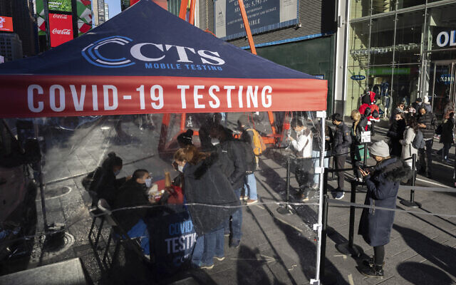 People wait in line at COVID-19 testing site in Times Square, on December 3, 2021, in New York. (AP Photo/Yuki Iwamura, File) People wait in line at COVID-19 testing site in Times Square, on December 3, 2021, in New York. (AP Photo/Yuki Iwamura, File)