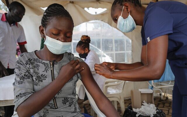 A nurse administers an AstraZeneca vaccination against COVID-19, at a district health center giving first, second, and booster doses to eligible people, in the low-income Kibera neighborhood of Nairobi, Kenya Thursday, Jan. 20, 2022. At least 2.8 million doses of COVID-19 vaccines donated to African countries have expired, the Africa Centers for Disease Control said Thursday, citing short shelf lives as the major reason. (AP Photo/Brian Inganga) A nurse administers an AstraZeneca vaccination against COVID-19, at a district health center giving first, second, and booster doses to eligible people, in the low-income Kibera neighborhood of Nairobi, Kenya Thursday, Jan. 20, 2022. At least 2.8 million doses of COVID-19 vaccines donated to African countries have expired, the Africa Centers for Disease Control said Thursday, citing short shelf lives as the major reason. (AP Photo/Brian Inganga)