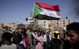 People chant slogans during a demonstration against the killing of dozens by Sudanese security forces since the October 25, 2021 military takeover, in Khartoum, Sudan, on January 20, 2022. (AP Photo/Marwan Ali)
