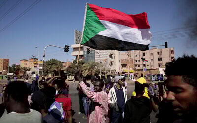 People chant slogans during a demonstration against the killing of dozens by Sudanese security forces since the October 25, 2021 military takeover, in Khartoum, Sudan, on January 20, 2022. (AP Photo/Marwan Ali)