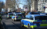 Illustrative: Police vehicles are parked on the grounds of Heidelberg University in Heidelberg, Germany, January 24, 2022. (R.Priebe/Pr-Video/dpa via AP)