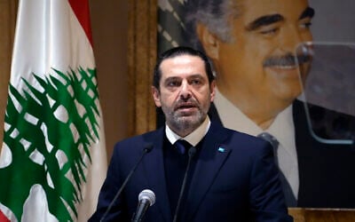 Former Lebanese Prime Minister Saad Hariri speaks during a press conference in front of a picture of his late father and former Prime Minister of Lebanon Rafic Hariri, at his house in downtown Beirut, Lebanon, Jan. 24, 2022. (Hussein Malla/AP)