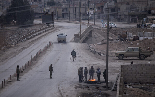 Fighters with the Kurdish-led Syrian Democratic Forces man a checkpoint in Hassakeh, northeast Syria, Monday, Jan. 24, 2022. (AP Photo/Baderkhan Ahmad) Fighters with the Kurdish-led Syrian Democratic Forces man a checkpoint in Hassakeh, northeast Syria, Monday, Jan. 24, 2022. (AP Photo/Baderkhan Ahmad)
