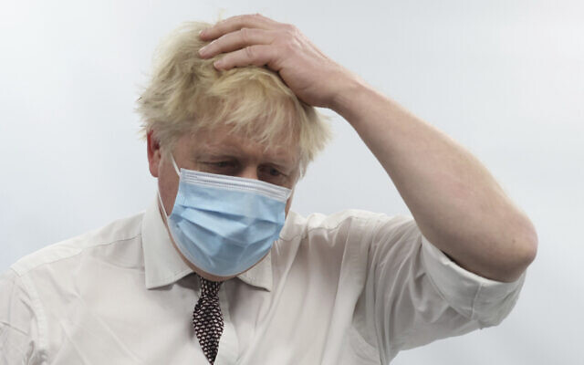 Britain's Prime Minister Boris Johnson gestures during a visit to Finchley Memorial Hospital, in North London, Jan. 18, 2022. (Ian Vogler, Pool Photo via AP) Britain's Prime Minister Boris Johnson gestures during a visit to Finchley Memorial Hospital, in North London, Jan. 18, 2022. (Ian Vogler, Pool Photo via AP)
