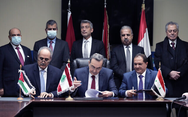 Front row from left to right, Amjad Rawashdeh, the Managing General Director of the Jordanian National Electric Power Company, Kamal Hayek, the Director of Electricity of Lebanon, and Fawaz al-Zaher, General Manager of Syrian Electricity Transmission and Distribution, sign deals to bring electricity from Jordan through Syria to Lebanon, at the Ministry of Energy and Water in Beirut, Lebanon, Jan. 26, 2022. (AP Photo/Bilal Hussein) Front row from left to right, Amjad Rawashdeh, the Managing General Director of the Jordanian National Electric Power Company, Kamal Hayek, the Director of Electricity of Lebanon, and Fawaz al-Zaher, General Manager of Syrian Electricity Transmission and Distribution, sign deals to bring electricity from Jordan through Syria to Lebanon, at the Ministry of Energy and Water in Beirut, Lebanon, Jan. 26, 2022. (AP Photo/Bilal Hussein)