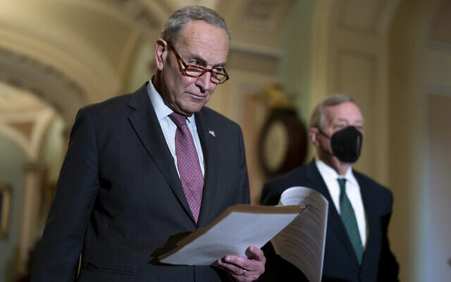 Senate Majority Leader Chuck Schumer, Democrat of New York, joined at right by Majority Whip Dick Durbin, Democrat of Illinois, speaks to reporters after a Democratic policy meeting at the Capitol in Washington, Dec. 14, 2021. (J. Scott Applewhite/AP) Senate Majority Leader Chuck Schumer, Democrat of New York, joined at right by Majority Whip Dick Durbin, Democrat of Illinois, speaks to reporters after a Democratic policy meeting at the Capitol in Washington, Dec. 14, 2021. (J. Scott Applewhite/AP)
