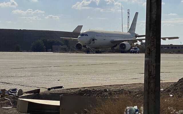 A damaged aircraft sits on the tarmac of Baghdad airport, after a rocket attack in Baghdad, Iraq, Jan. 28, 2022. (AP Photo/Ali Abdul Hassan)