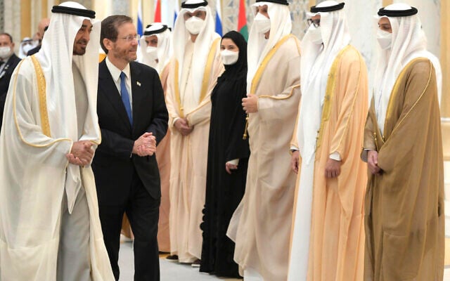 President Isaac Herzog, walks with the Crown Prince of Abu Dhabi, Sheikh Mohammed bin Zayed Al Nahyan, left, as he arrives at the royal palace, in Abu Dhabi, United Arab Emirates, Sunday, Jan. 30, 2022. (Amos Ben Gershom/GPO via AP) President Isaac Herzog, walks with the Crown Prince of Abu Dhabi, Sheikh Mohammed bin Zayed Al Nahyan, left, as he arrives at the royal palace, in Abu Dhabi, United Arab Emirates, Sunday, Jan. 30, 2022. (Amos Ben Gershom/GPO via AP)