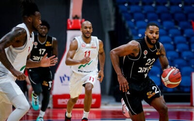 Illustrative: Members of Hapoel Beersheba play against Hapoel Jerusalem at the Balkan International Basketball League match in Jerusalem, on October 22, 2020. (Flash90)